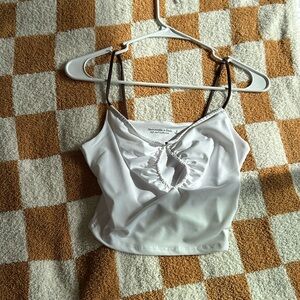 Abercrombie White crop top with brown straps.